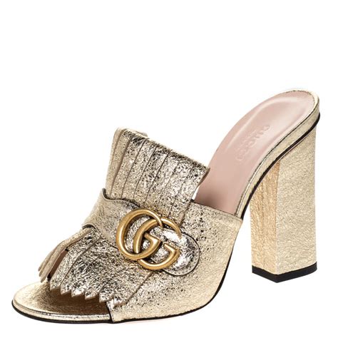 gold gucci mules|gucci marmont fringe mules.